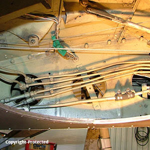 viewing the inside tubing and piping of navion airplane before restoration